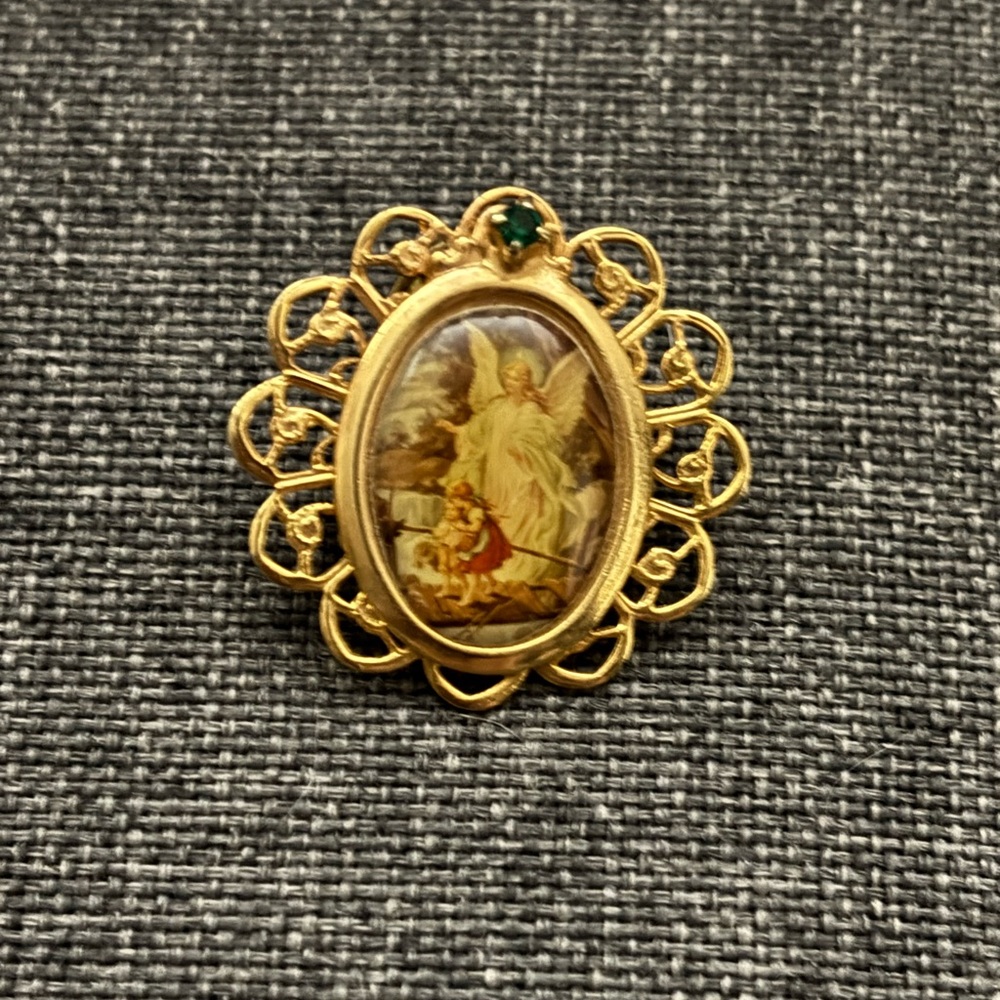 Elegant Gold Angel Brooch with Green Accent